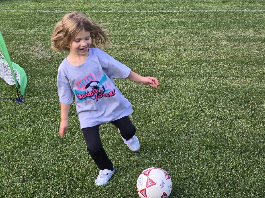 Ceci playing soccer